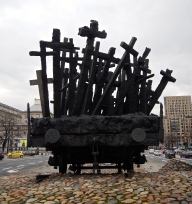 Monument near the place where more than 300,000 Jews from Warsaw Ghetto were sent to their deaths in concentration camps - railway carriage has crosses, hands and faces in the metal - very moving