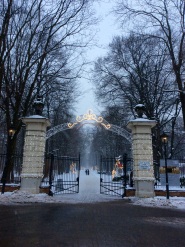 Łazienki park entrance with some christmas lights still shining